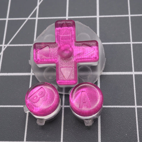 Hand cast custom resin buttons for Nintendo Game Boy Advance - Chrome pink | Lab Fifteen Co