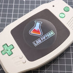 Hand cast custom resin buttons for Nintendo Game Boy Advance - Chrome Green | Lab Fifteen Co